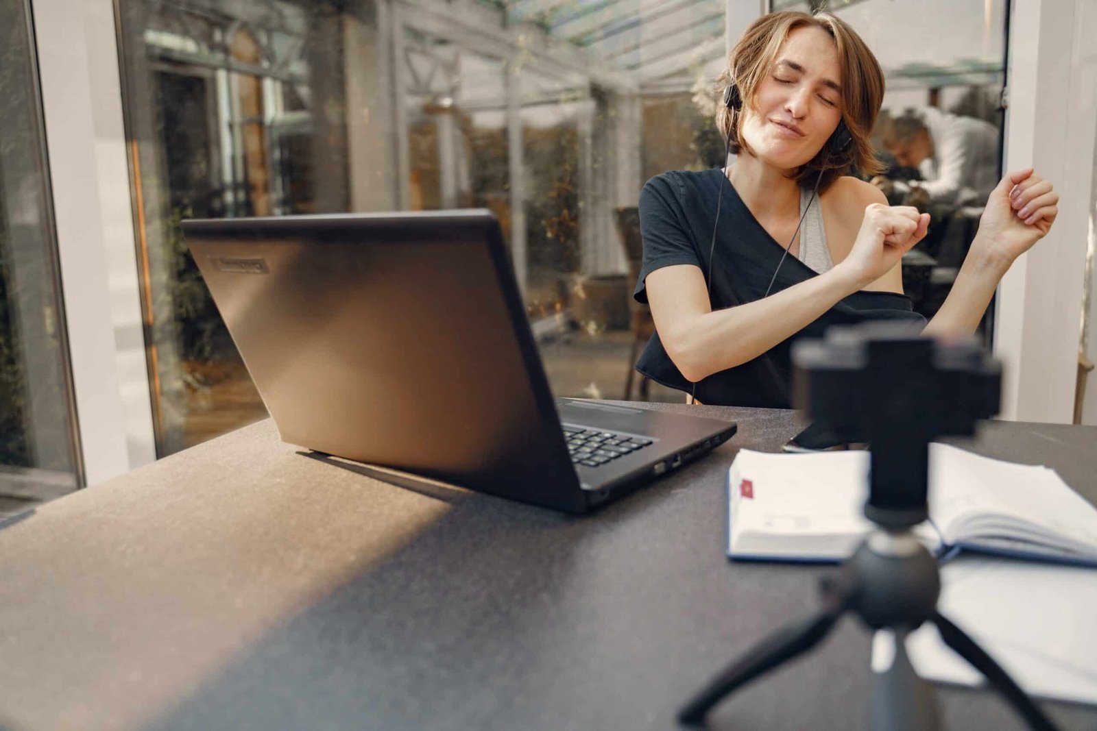 Woman having fun sitting with a laptop